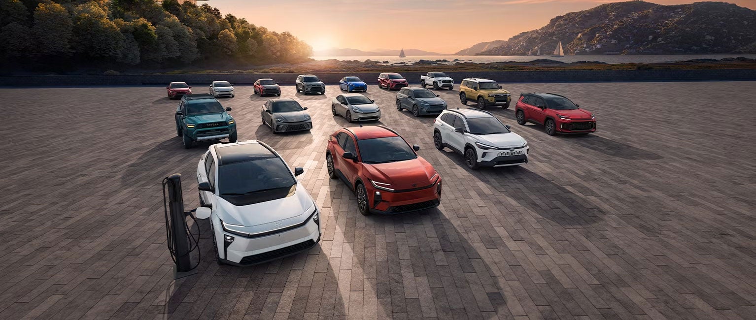 Wide shot of the complete Toyota electric and hybrid vehicle lineup at the Classic Toyota Waukegan EV Center